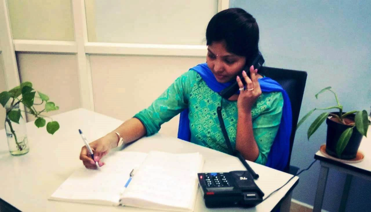Healthcare worker documenting and offering tele-counselling on HIV/AIDS